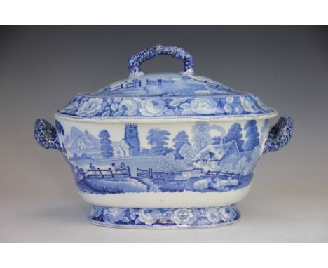A 19th century blue and white printed tureen and cover, the scene depicting a rural hamlet with figures chatting by a gate wi