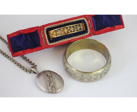 A Victorian yellow metal hinged bangle, with pierced foliate design and set with split seed pearls (some missing) 12.2gms wit