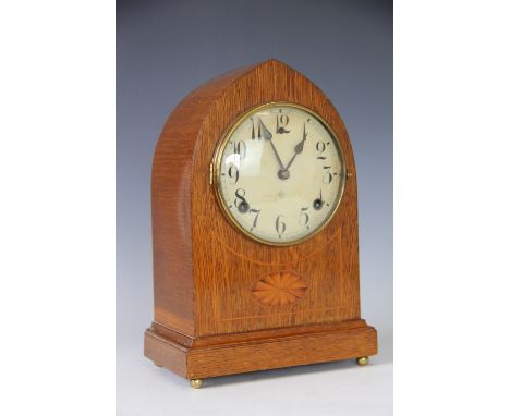 An Edwardian inlaid walnut lancet shaped mantel clock, with Arabic dial and movement striking on a gong, 31cm