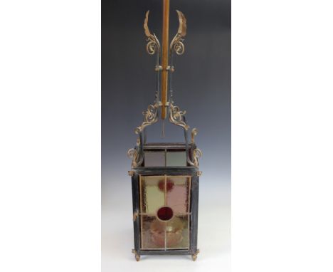A Victorian painted and gilt metal hall lantern, for oil, with foliate upper section, the square section lantern with stained
