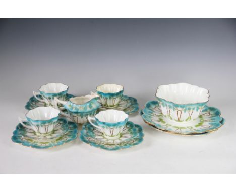 A collection of Foley China Wileman Shelley tea wares, each of lobed form and decorated with Art Nouveau sinuous flowers in t