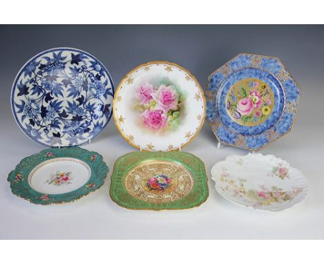 A collection of four decorative plates, to include; A Royal Worcester cushion shaped plate with central painted floral rounda