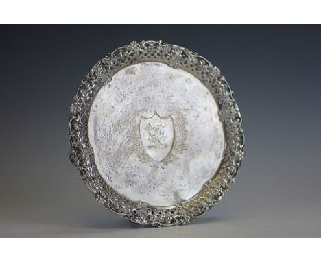 A waiter with pierced trellis and florally cast rim, raised on three bracket feet, bearing inscription 'Edmund Sleigh, Rossal