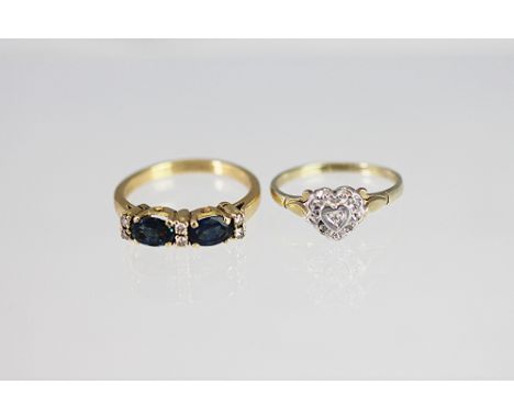 A diamond and sapphire ring, the two sapphires and six diamonds all set in yellow gold stamped '18c', weight 3.9gms along wit