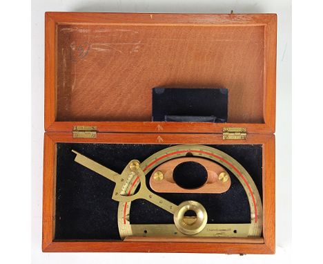 A cased WWII military issue brass protractor by C. Smith (Clerkenwell) Ltd, dated 1940 with military arrow, in walnut case 