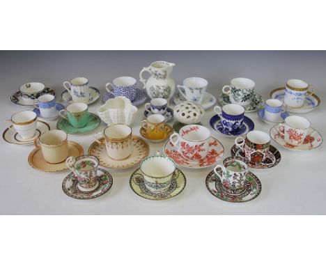 A selection of 19th century and later coffee and tea cups and saucers, many Worcester examples and others, including Crown De