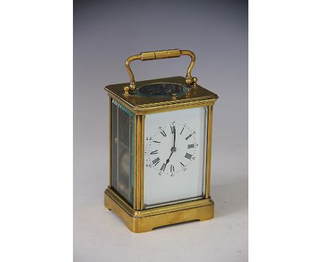 A late 19th century French brass repeating carriage clock, Roman numeral enamel dial with movement striking on a gong, 13.5cm
