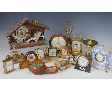 An assortment of barometers and time pieces, to include a fret cut barometer with inset thermometer, 54cm