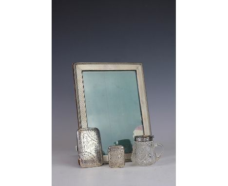 A silver photograph frame, stamped 'Sterling' with engine turned and beaded detail and oak back, 21cm x 16cm along with a sil