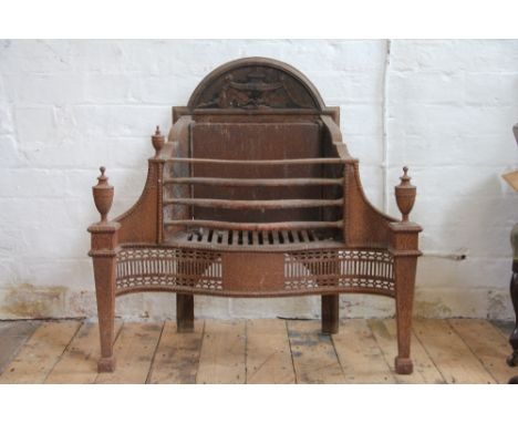 A George III style cast iron serpentine fire grate, with arched back plate, on tapered square legs, 74cm H x 77cm W