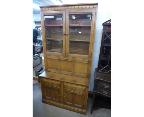 An Ercol Golden Dawn elm bookcase 