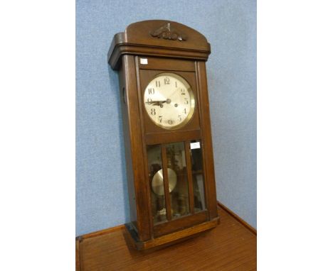 An Edward VII oak cased wall clock 