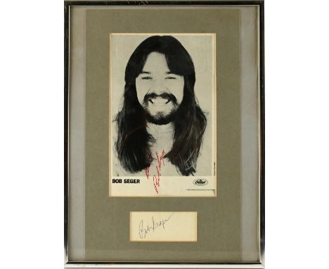 Bob Seger - Capitol records promo headshot signed by Bob Seger in red pen with separate piece of paper signed in biro. Mounte