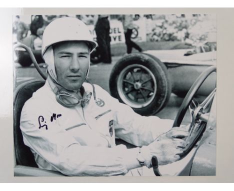 AUTOGRAPH: A black/white 10 x8 photograph signed by and featuring STIRLING MOSS - this item has been independently checked an