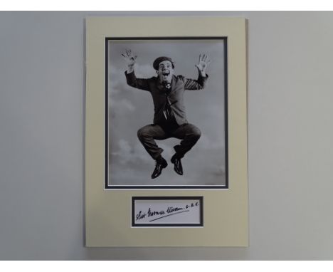 AUTOGRAPH: SIR NORMAN WISDOM - mounted photograph and autograph display - this item has been independently checked and will b
