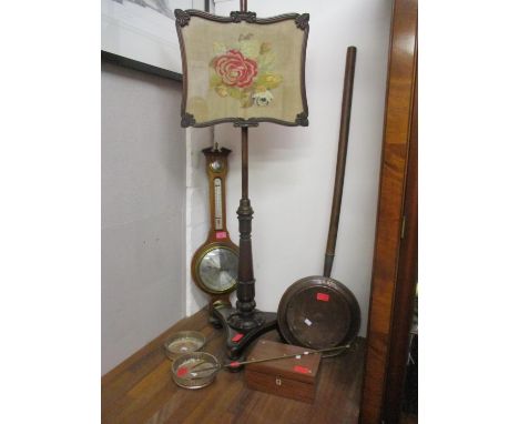 A Regency mahogany pole screen, a barometer, a pair of wine bottle coasters, a warming pan, a toasting fork and a sewing box 