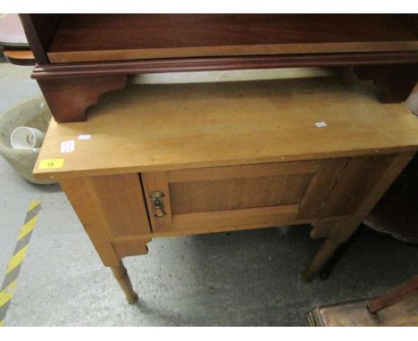 An Edwardian light oak wash stand with extended back, single cupboard door with Art Nouveau handle on turned legs, along with