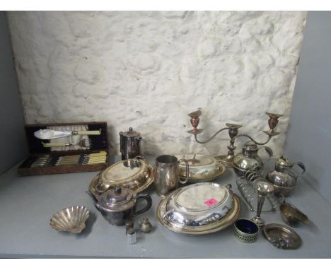 A selection of silver and silver plate to include a continental silver slave bangle mounted on a plate base, silver spill vas