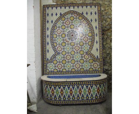 A 20th century Moroccan fountain tiled in a floral mosaic design in red, blue, green, yellow and mother of pearl colour, havi
