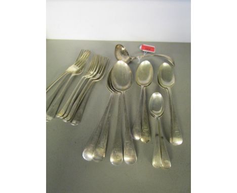 A part set of Victorian silver cutlery, each with an engraved crest comprising one ladle, three large forks, fire smaller, fo