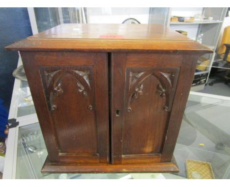 An early 20th century oak smokers cabinet made from partly burnt oak, taken from Selby Abbey after the Great Fire October 190