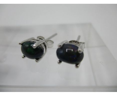 A pair of black Ethiopian opal stud earrings in silver settingsLocation: CAB 