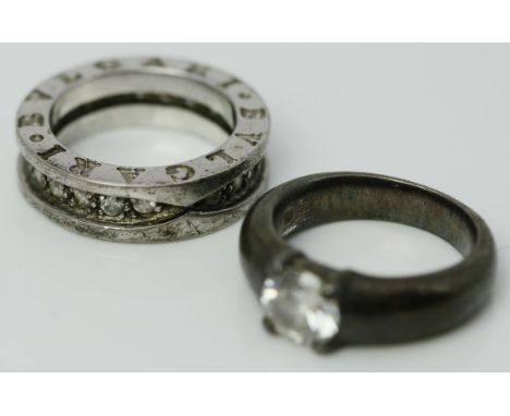 Ring, BVLGARI und Damenring. 925/000 Sterlingsilber. Je mit rund facettiertem, farblosen Besatz. Tragespuren. RW ca. 52.