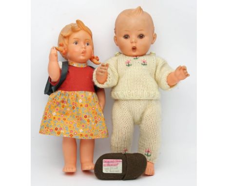 2 Hummel-Puppen. Vinyl. Je gem. und bez. "Western Germany". 1x als Bub, 1x als Mädchen. Bekleidung teils erg. Bespielt. L. 32