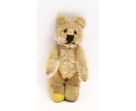 Teddy-Baby,Steiff. Blonder Mohair mit Samtfüßen (1x rep.). 5-fach gegliedert, eingesetzte, braune Glasaugen. Bespielt. 50er J