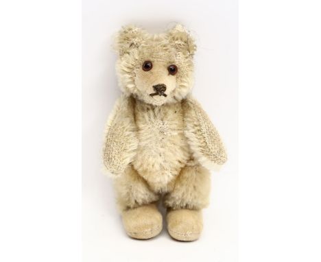 Teddy-Baby, Steiff. Blonder Mohair mit Samtfüßen. 5-fach gegliedert, eingesetzte, braune Glasaugen. L. bespielt. 50er Jahre. 