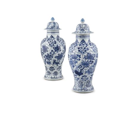 A NEAR PAIR OF BLUE AND WHITE KANGXI STYLE LIDDED VASESChina, Kangxi styleH: 28 cm