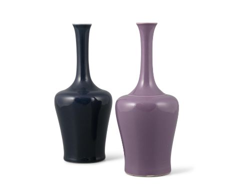 A NEAR PAIR OF MALLET SHAPED PORCELAIN VASESChina, Modern, Kangxi style One covered with a purple glaze. The other one covere