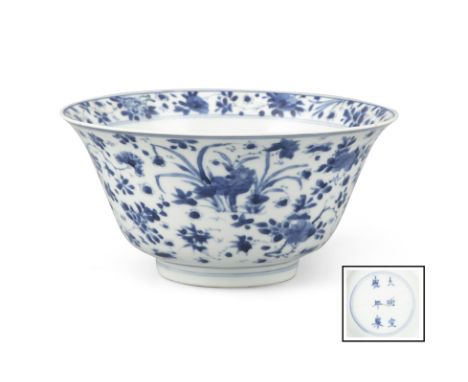 A BLUE AND WHITE ‘HUNDRED FLOWERS’ PORCELAIN BOWL&nbsp;China, Qing Dynasty, Kangxi periodThe base inscribed in cobalt blue wi