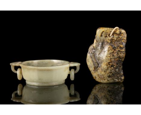 A GROUP OF TWO (2) JADE CARVINGSChina, ModernOne is a small jade marriage bowl with loose rings inscribed with the apocryphal