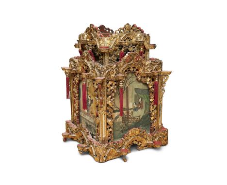 A LARGE GILT AND RED LACQUERED LANTERNChina, Late Qing Dynasty, Circa 1900sEach side is set with a glass panel on which a pai