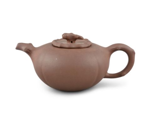 A WATERMELON-SHAPED YIXING ZISHA TEAPOTChina, 20th centuryH: 10cm西瓜形宜兴紫砂茶壶，中国，20世纪。10厘米高Condition Report:  - Maybe a tiny chi