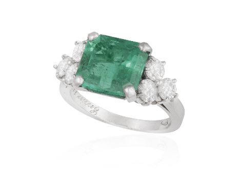 AN EMERALD AND DIAMOND DRESS RINGThe cut-cornered rectangular-cut emerald weighing approximately 4.20cts within a four-claw s