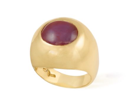 A RUBY AND DIAMOND RINGOf bombé shape centering an oval-shaped ruby cabochon, to a polished gold mount, mounted in 18K gold, 