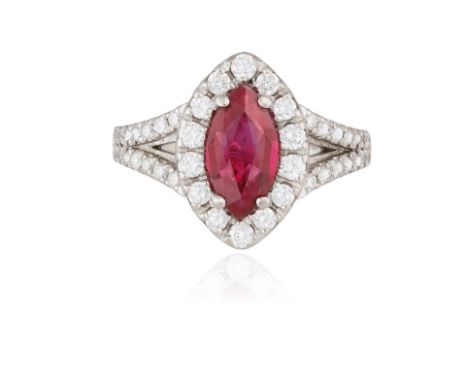 A RUBY AND DIAMOND DRESS RINGThe central marquise-shaped ruby weighing 1.00ct, within a surround of brilliant-cut diamond to 