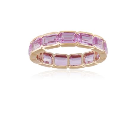 A COLOURED SAPPHIRE ETERNITY RINGComposed of a continuous line of rectangular-cut pink sapphires within collet-setting, mount