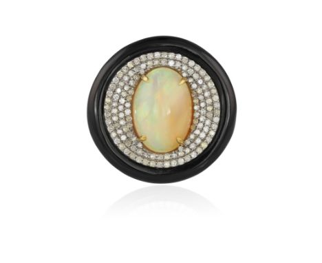 AN OPAL, ONYX AND DIAMOND COCKTAIL RINGThe central oval-shaped cabochon oval within a surround of single-cut diamonds to a po