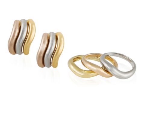 A PAIR OF GOLD EARCLIPS WITH THREE RINGS EN SUITEEach clip of wavy bombé design in tri-coloured gold, with three rings en sui