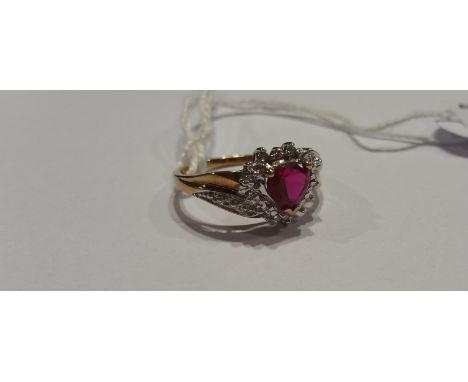 A 10ct Diamond and Ruby Cluster Ring.