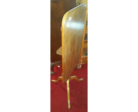 A Victorian Rectangular Snap Top Wine Table; with a turned pillar and tripod base.