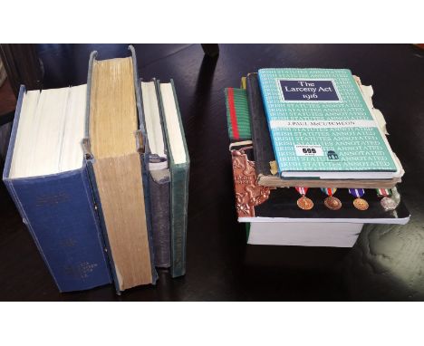 A Collection of Garda Siochana Books to include 5th Ed. Guide, Code Book, etc. Also Medals of Defence, etc.