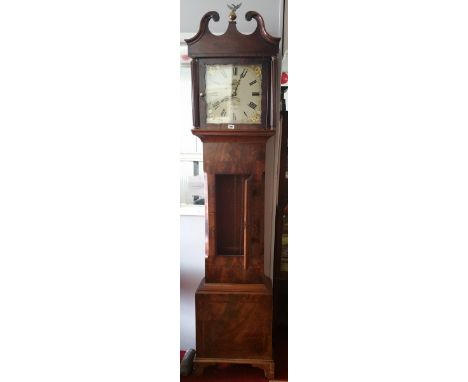 An Early 19th Century Mahogany and Crossbanded Longcase Clock; the painted square dial having date aperture, the hood with sw