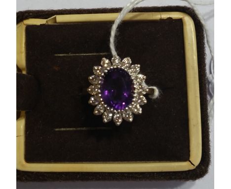 A 9ct Diamond and Amethyst Ring, amethyst approx 2 carat and diamonds approx .75 carat.