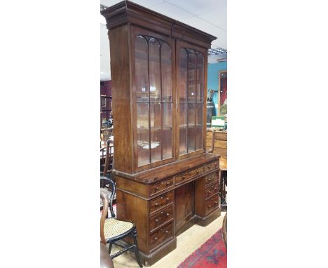 A Victorian Mahogany Large Secretaire/Dickens Bureau Bookcase; the breakfront desk with drawers and pull out desk top, above 