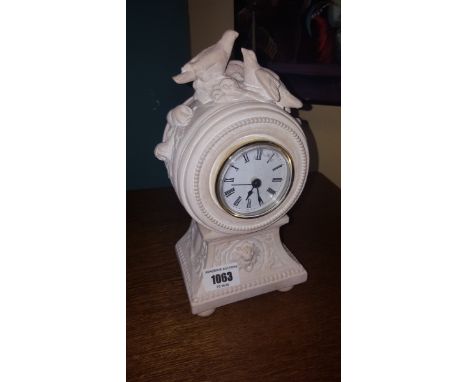 A White Composition Mantel Clock.