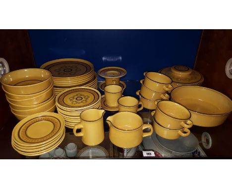 A Shelf of Yellow Glazed Franciscan Table Wares.